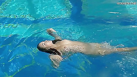 Busty brunette teen in lingerie masturbates in pool