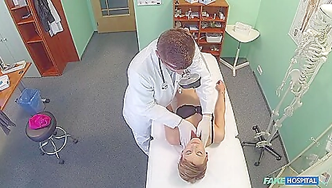 Amateur blonde in a white blouse and a black skirt