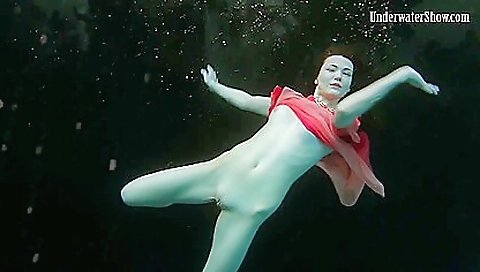 Brunette beauty shows off her natural body on the beach