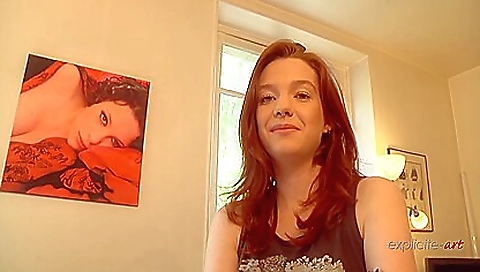 A gorgeous redhead with huge hirsute body is doing a blowjob