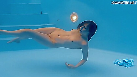 Marfa swims nude in the pool in a romantic bath scene