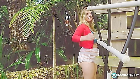 Hot brunette in sexy stockings outside of the house