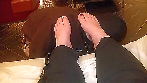 Busty brunette with stockings is doing foot fetish