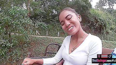 Thai beauty rides a big cock in a big outdoor party