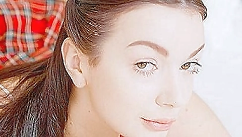 Sexy teen babe in pink top and skirt is playing with her headset