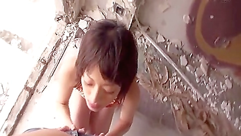 Sexy Asian babe in a swimsuit and stockings in bathroom